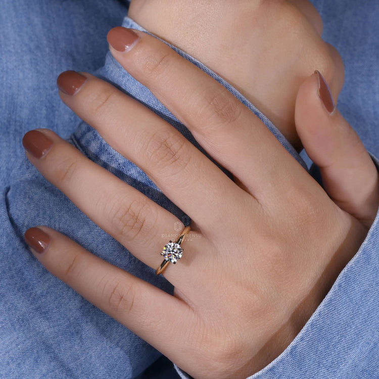 Solitaire round engagement ring featuring a round cut diamond, perfect as an engagement ring for women with modern style.
