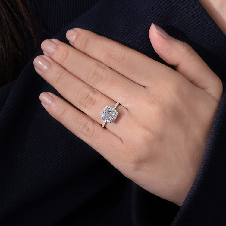 UK engagement ring in a cushion cut with a halo design, perfect for special moments.
