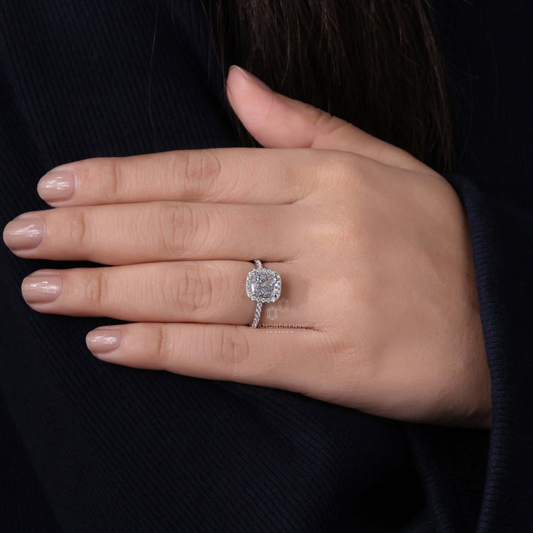 2 carat cushion cut diamond ring with halo detailing, perfect for a 
classic engagement look.
