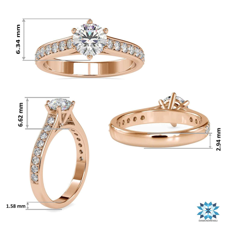 Yellow gold ring featuring round diamond and side stones.
