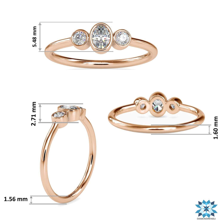 White gold three stone ring with oval and round diamond combination.
