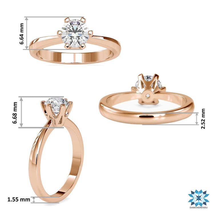 White gold ring with tapered shank and round cut lab diamond.
