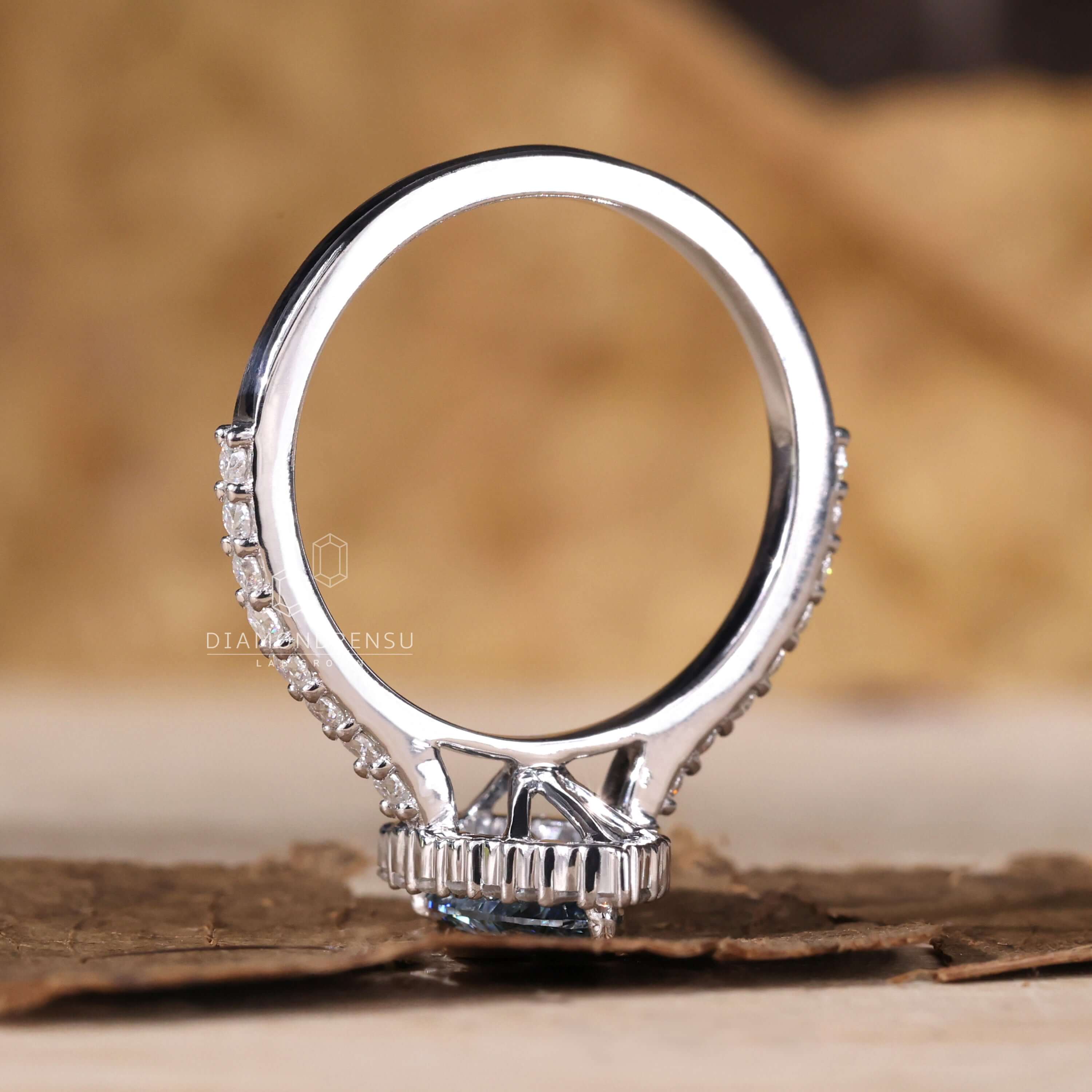 Gorgeous pear shaped halo engagement ring with handmade finish.