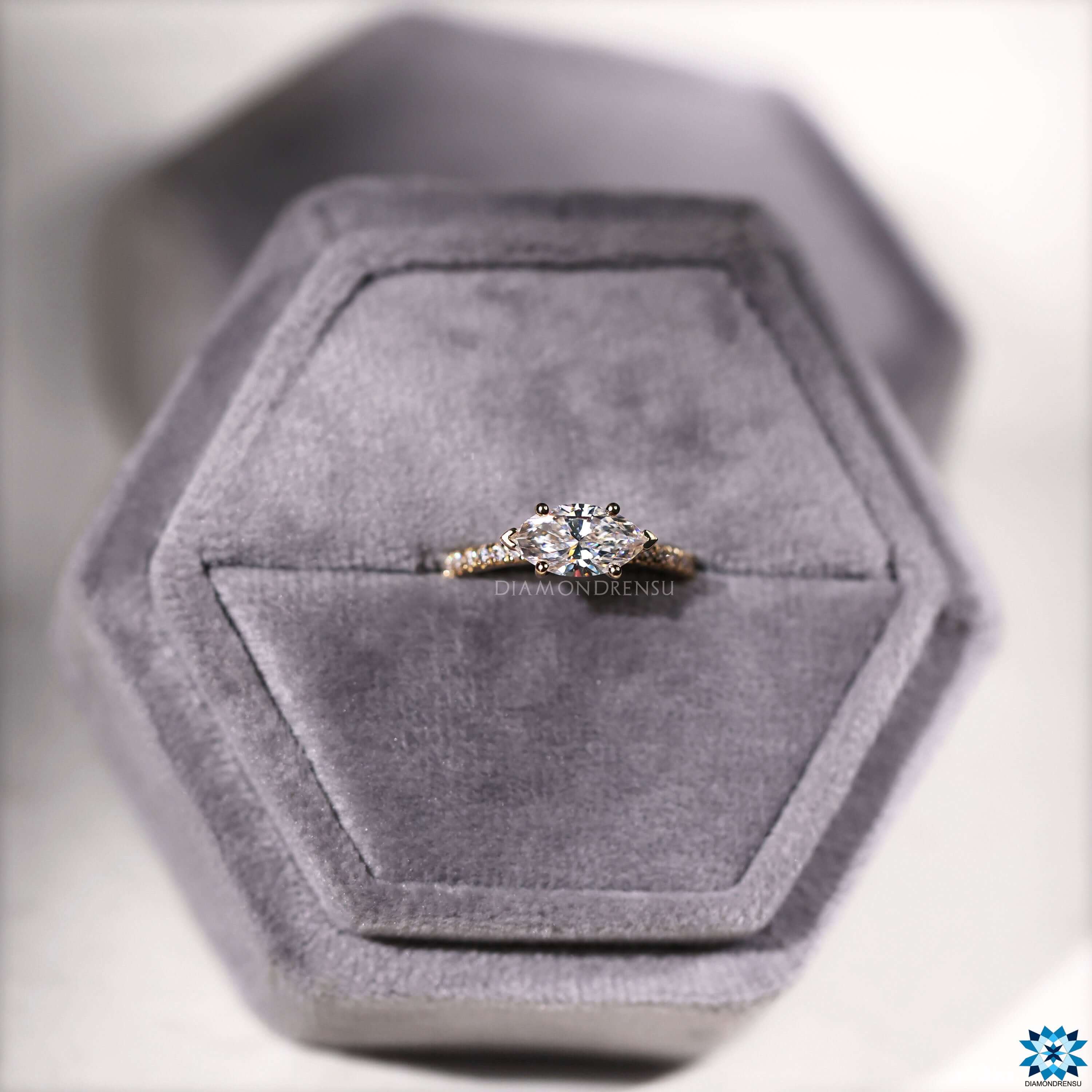 V shaped prong setting with a stunning marquise moissanite diamond.