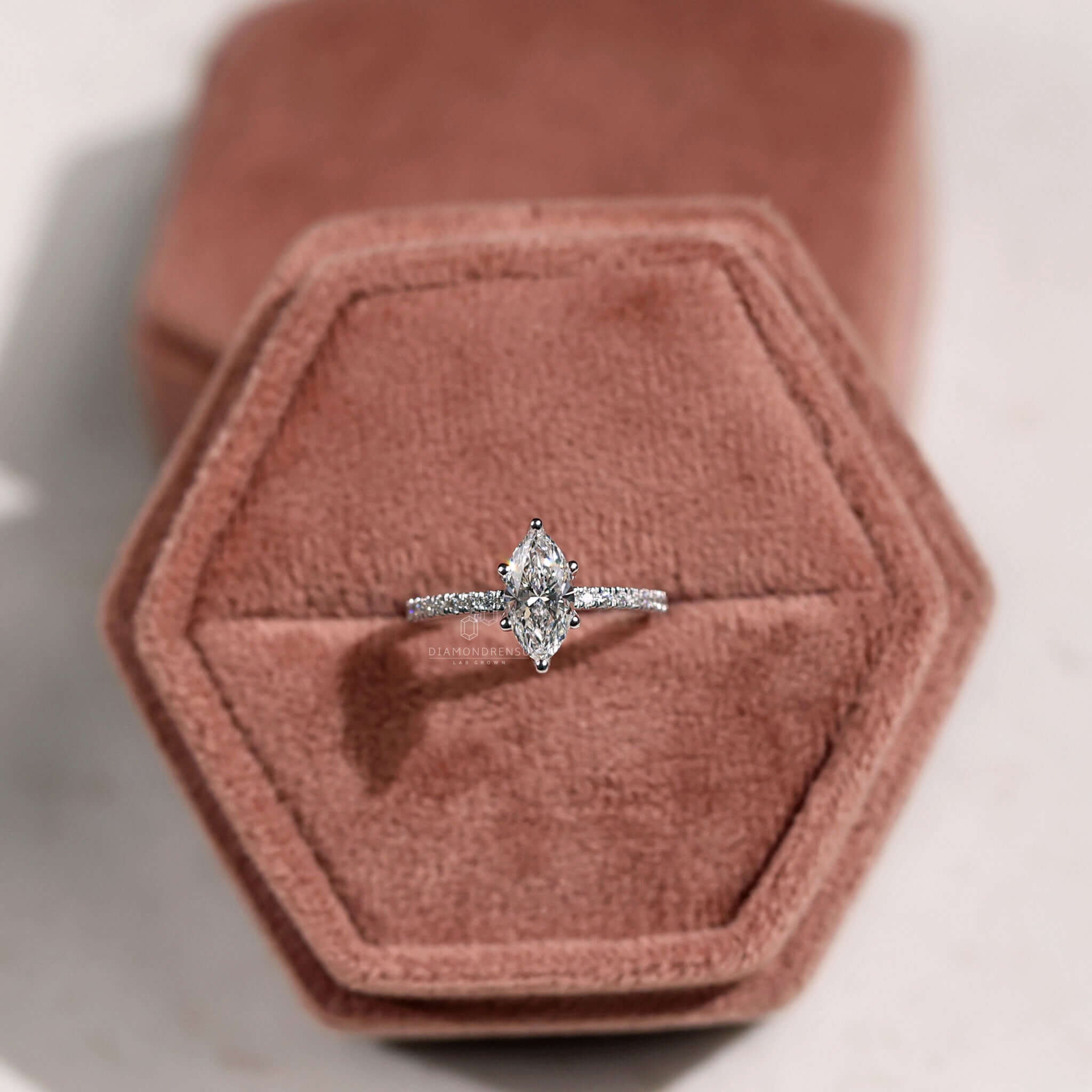 Handmade marquise pave engagement ring with lab-grown diamonds.