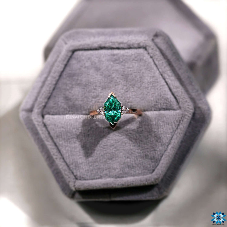 Infinity shank ring in yellow gold with Dutch marquise cut moissanite.
