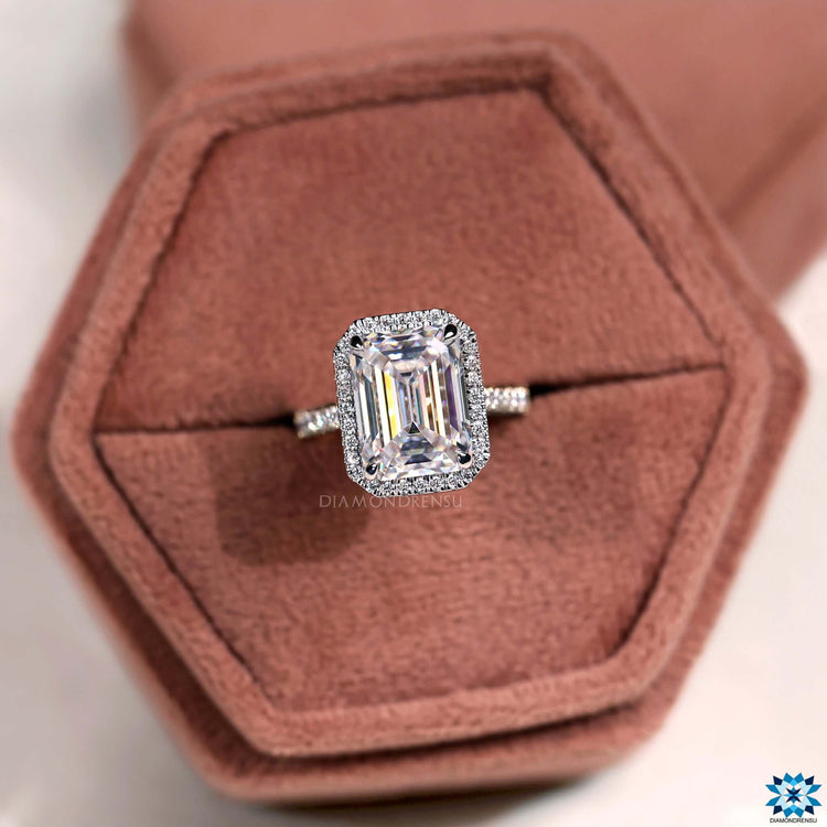 Custom emerald cut moissanite ring with prong setting.
