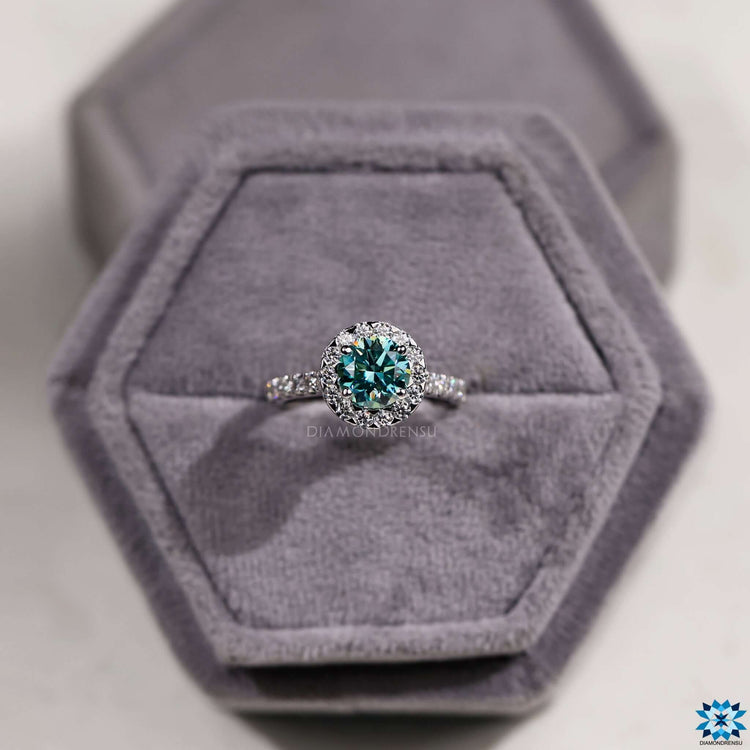 Cathedral setting ring with round cut moissanite.
