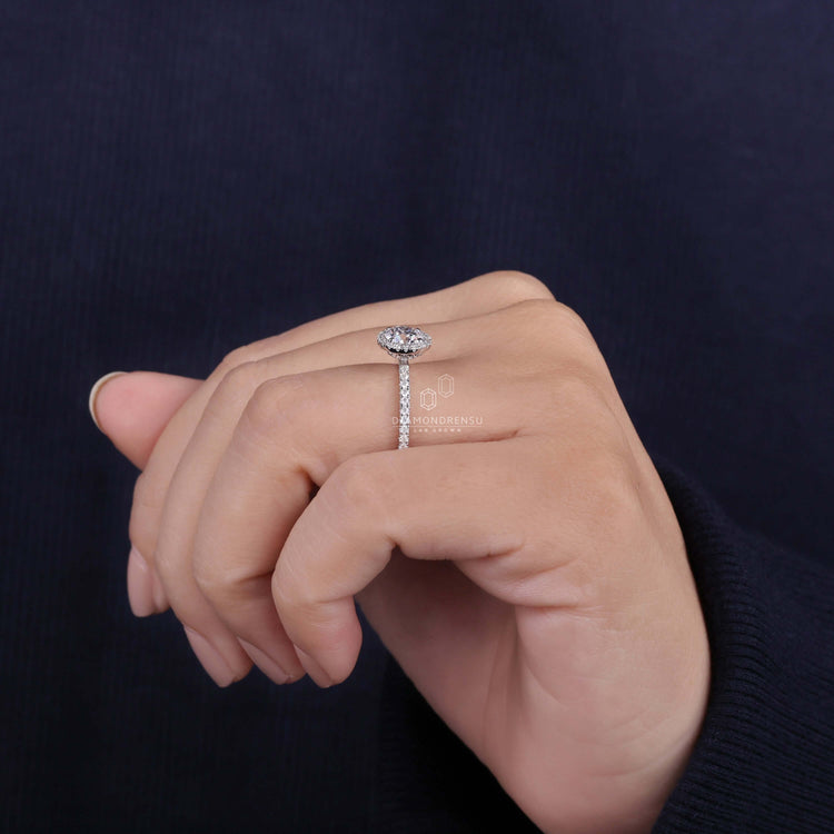 IGI certified round diamond ring showcasing a classic halo setting
