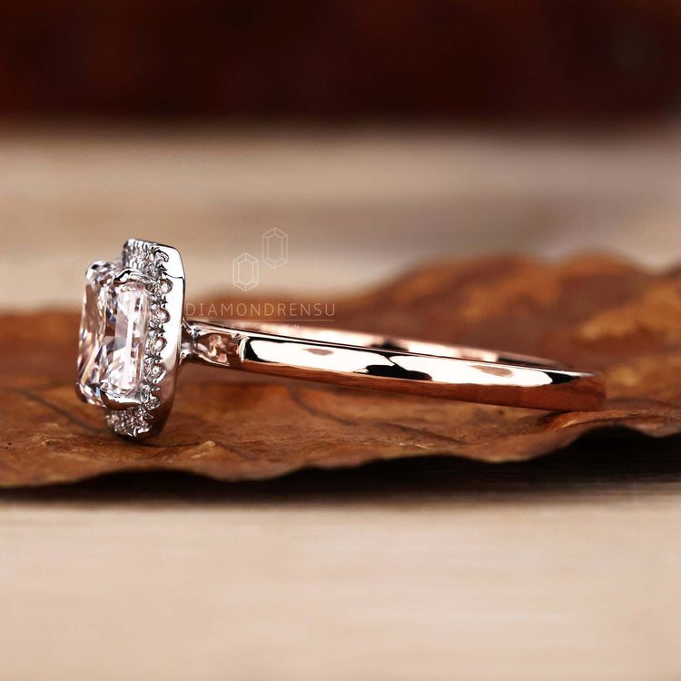 Halo ring with radiant cut diamond crafted in a handmade jewelry design, ideal for a special occasion.
