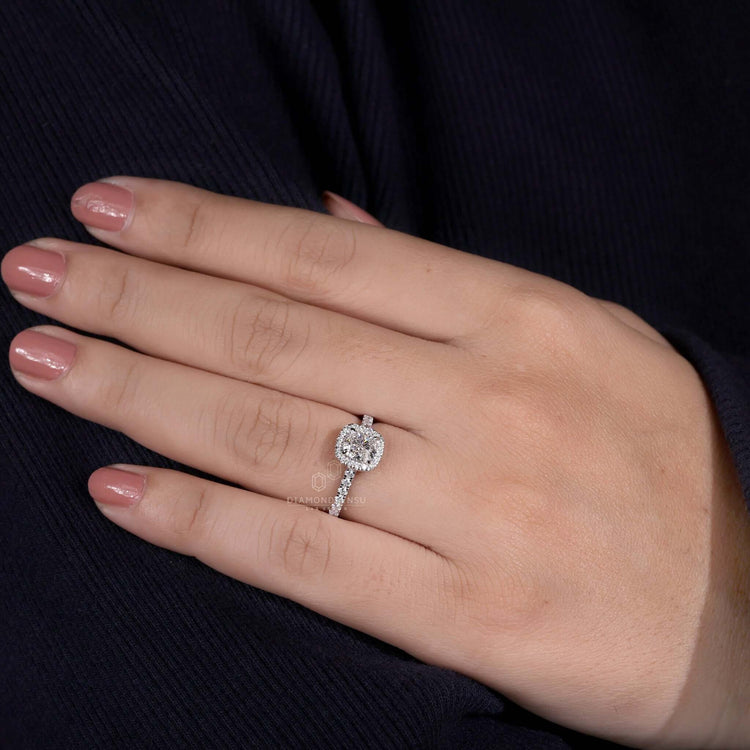 Halo diamond ring with a cushion cut centre stone for timeless beauty
