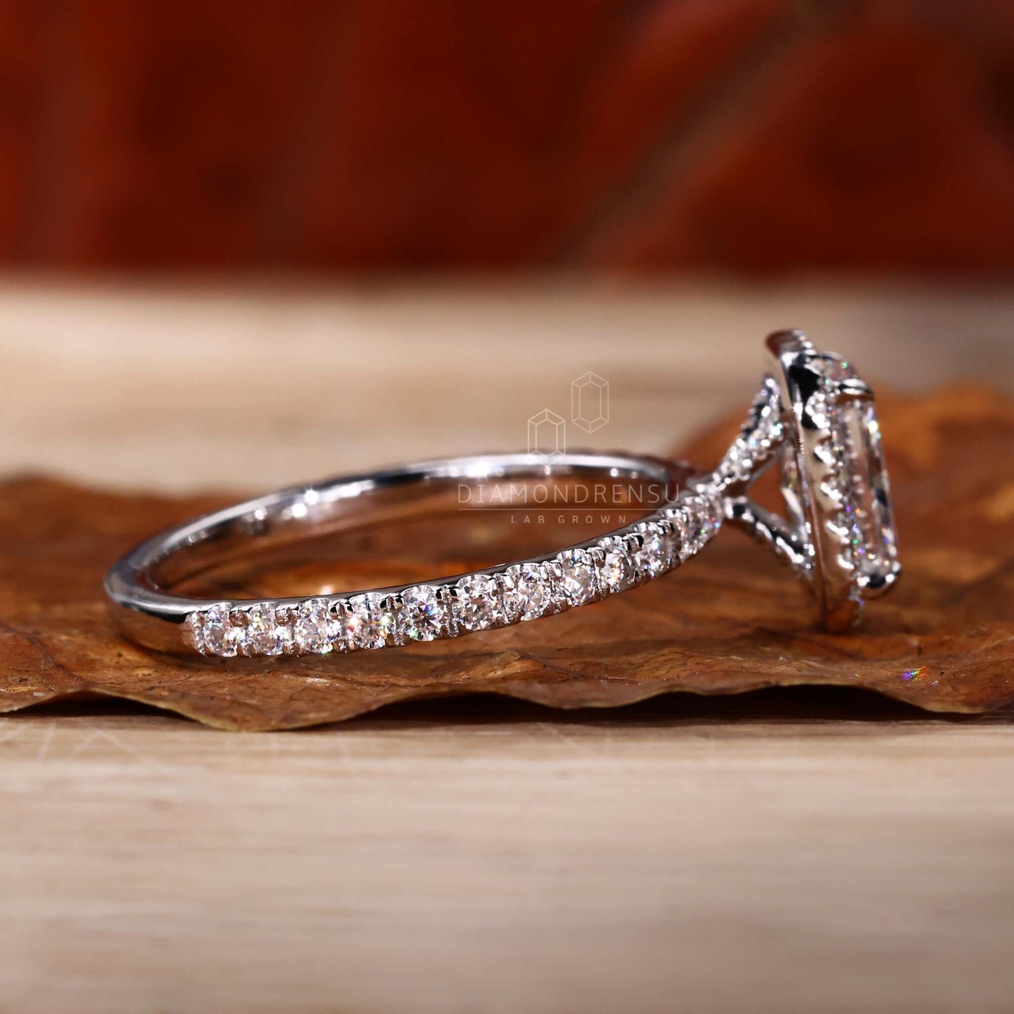 Radiant cut ring featuring pave diamonds and a halo ring ring for a unique engagement ring appeal.
