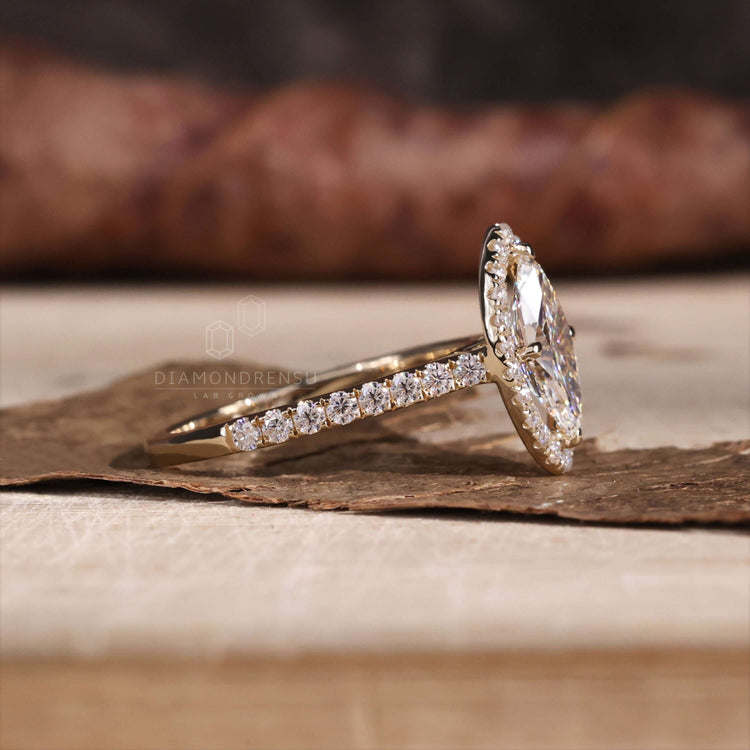 Marquise cut engagement ring crafted with yellow gold elegance
