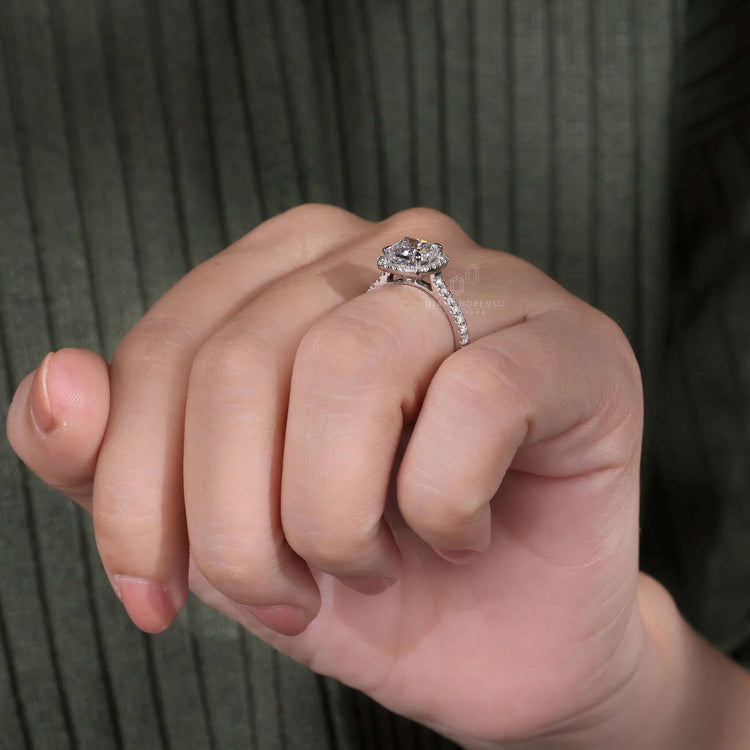 Engagement ring pave featuring a cushion cut diamond and halo accents.
