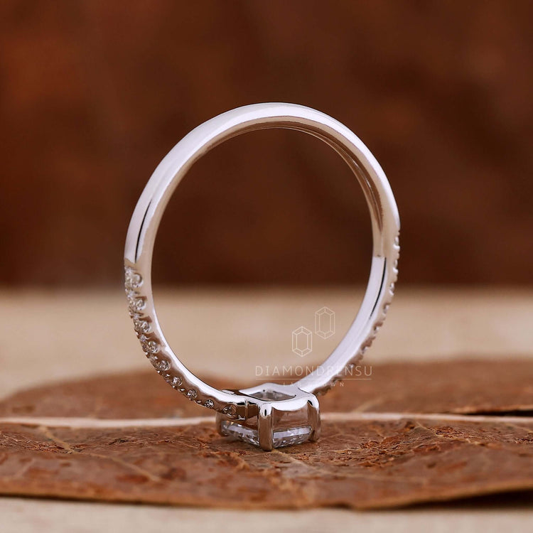 Emerald cut pave diamond ring with a luxurious finish.