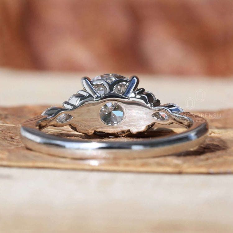 Round cut diamond engagement ring with a muse setting, showcasing a timeless and elegant design.