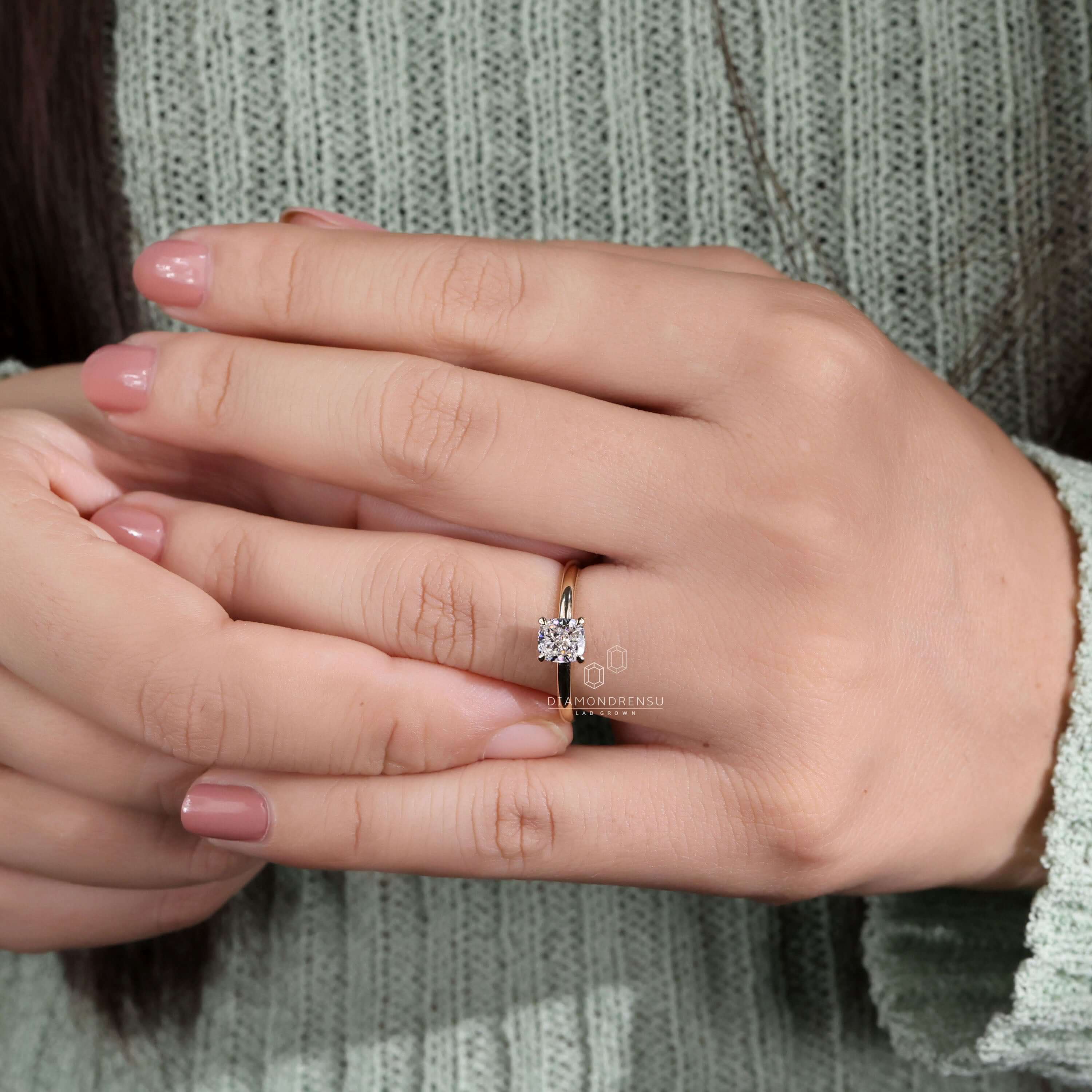 Cushion ring crafted with a claw prong setting, perfect as a minimalist engagement ring for a sleek and stylish look.
