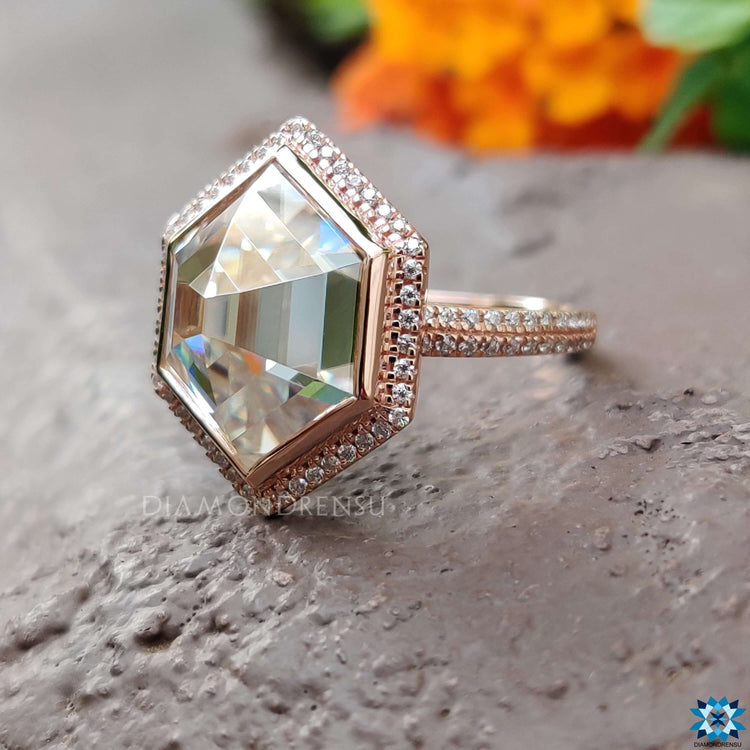 Rose gold halo engagement ring with round cut halo.
