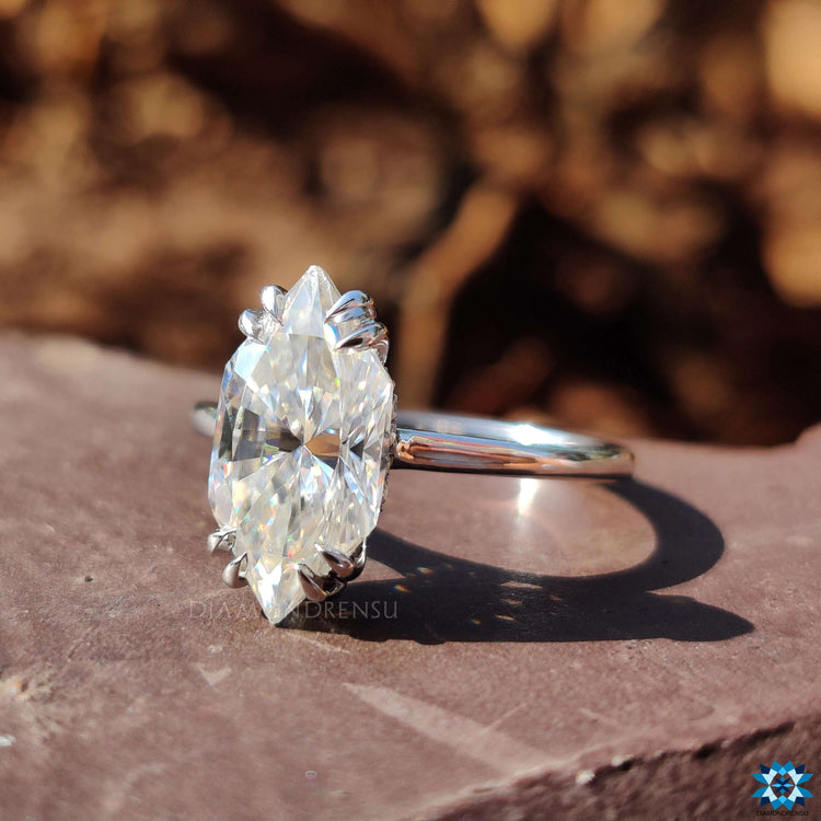 Solitaire setting ring with hidden halo detail.
