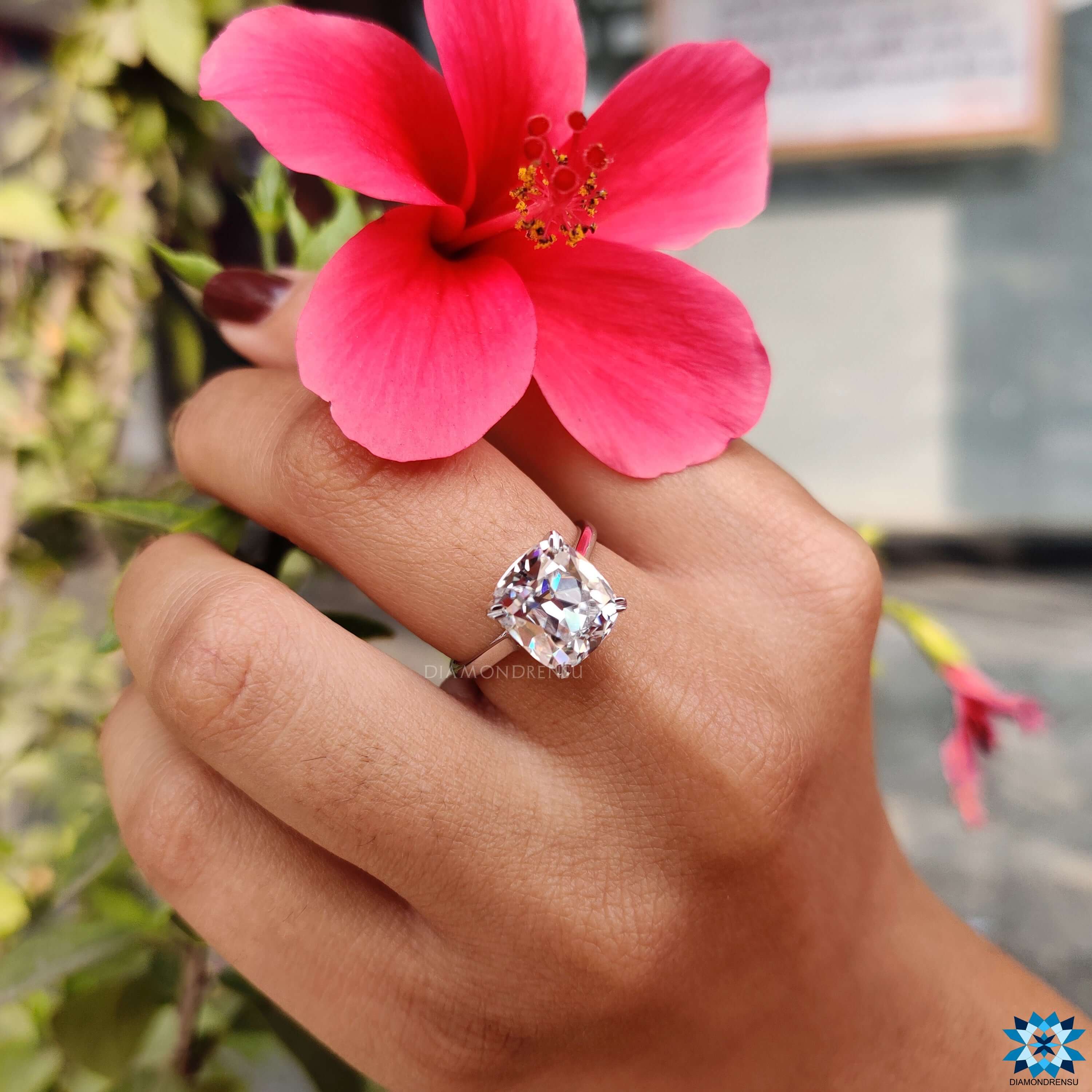 Moissanite for engagement ring set in a timeless cushion cut moissanite ring design.