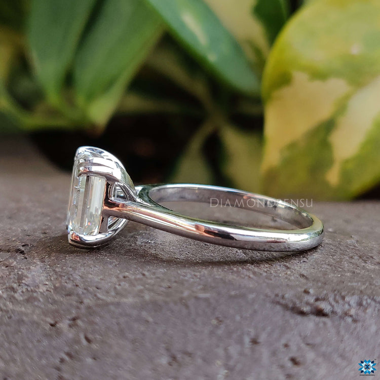 Buy custom emerald cut moissanite engagement ring.
