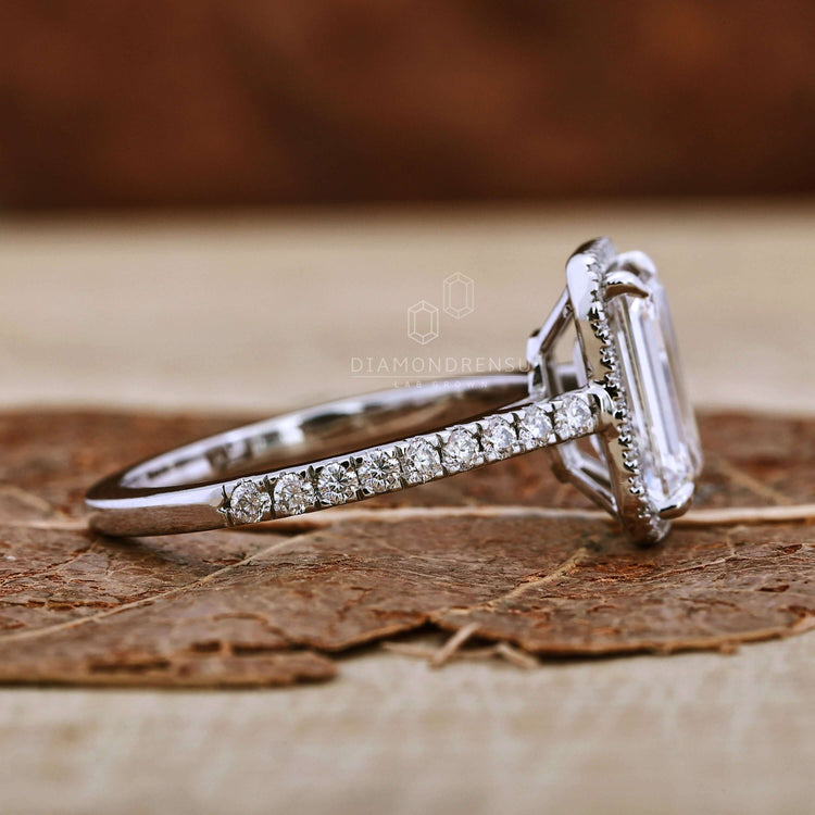 Emerald cut engagement ring crafted with a white gold cathedral setting
