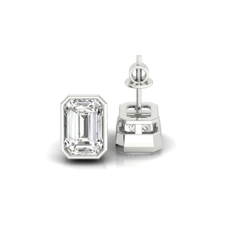 Handmade jewellery showcasing emerald cut bezel set diamond studs.
