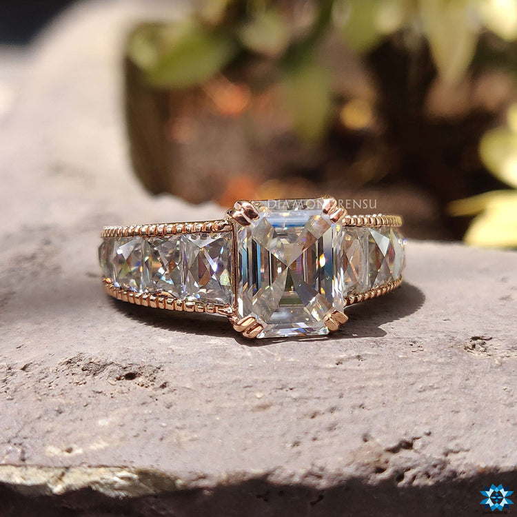 Channel setting emerald moissanite ring.
