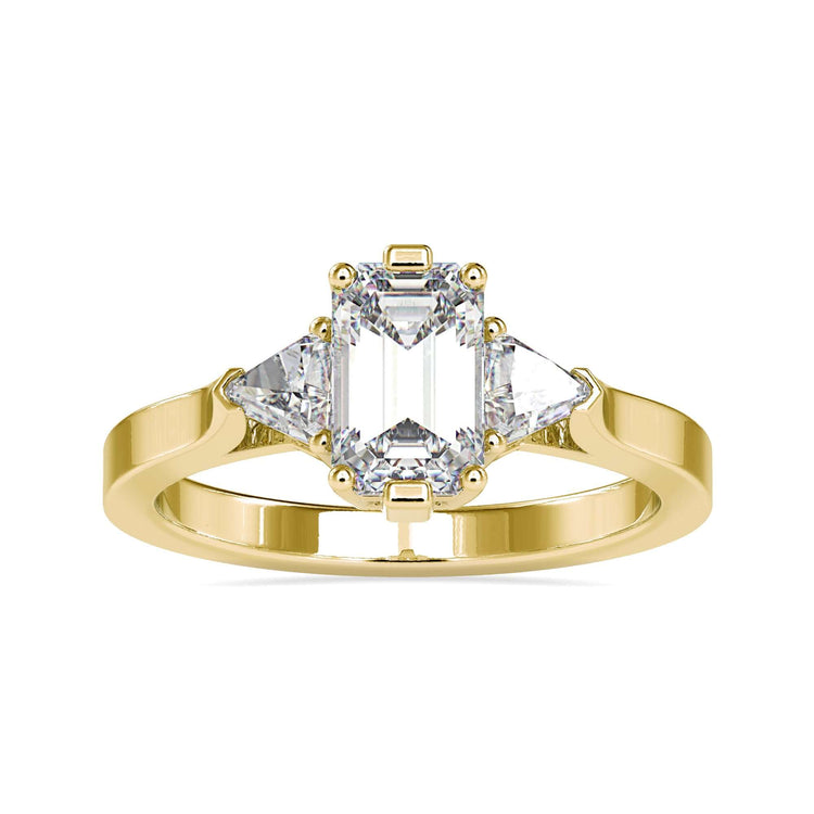 Yellow gold ring with emerald cut diamond and trillions.
