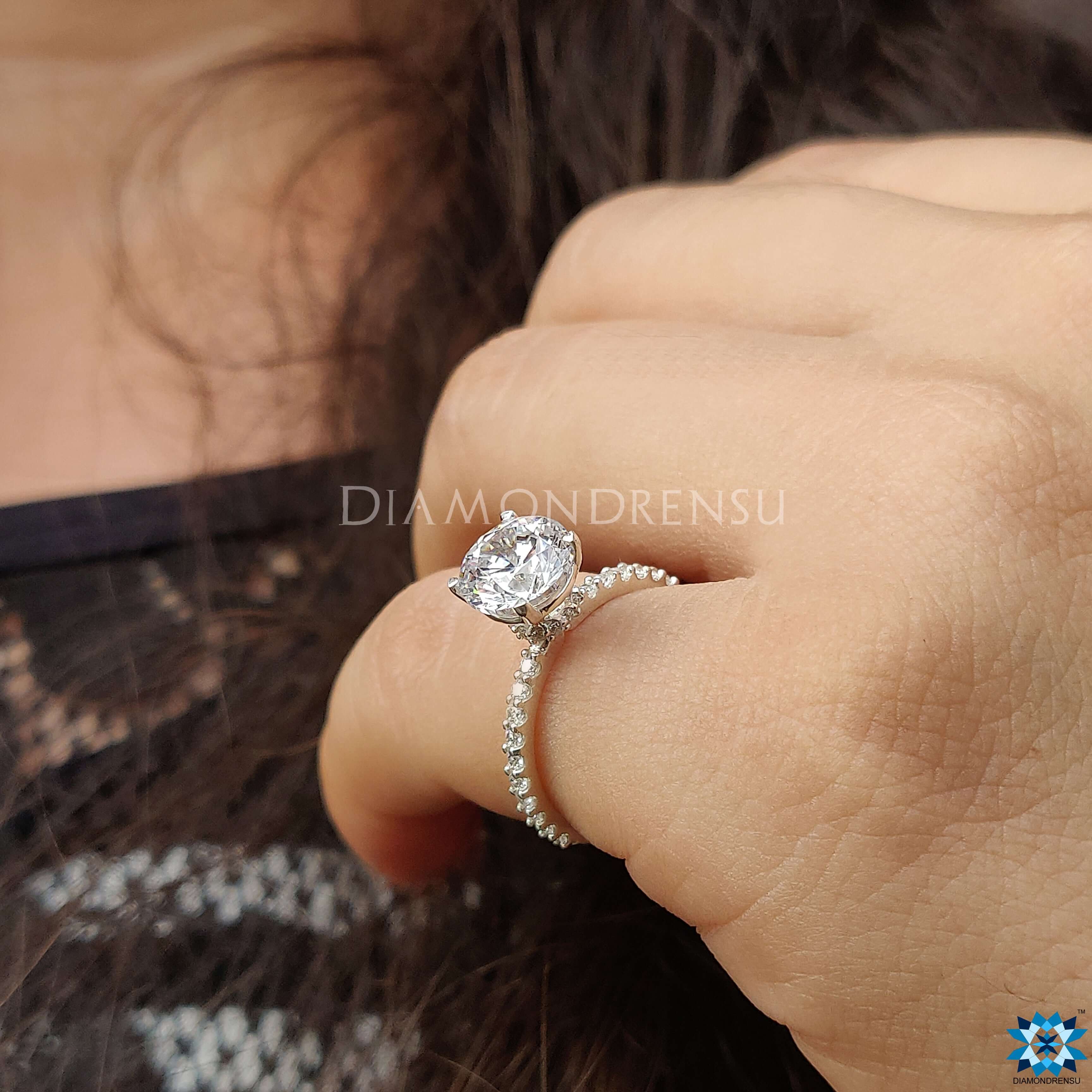 Moissanite ring with a pave setting ring design, showcasing exceptional sparkle.