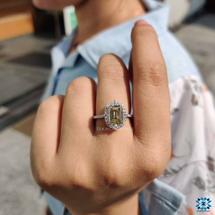 Emerald cut moissanite halo ring with pave setting.
