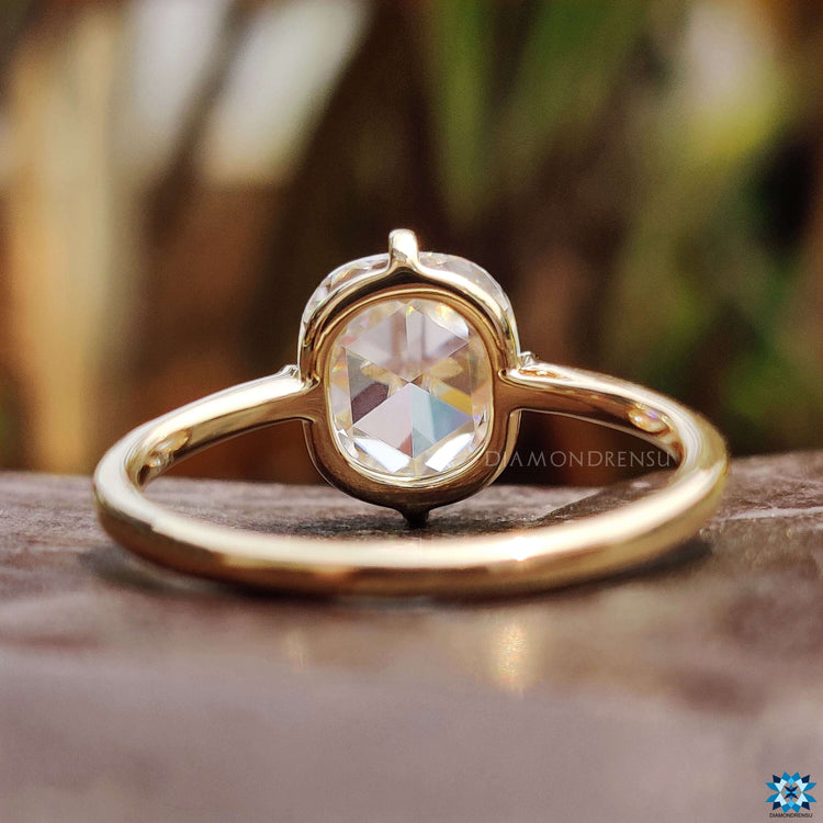 Handmade moissanite ring in yellow gold.
