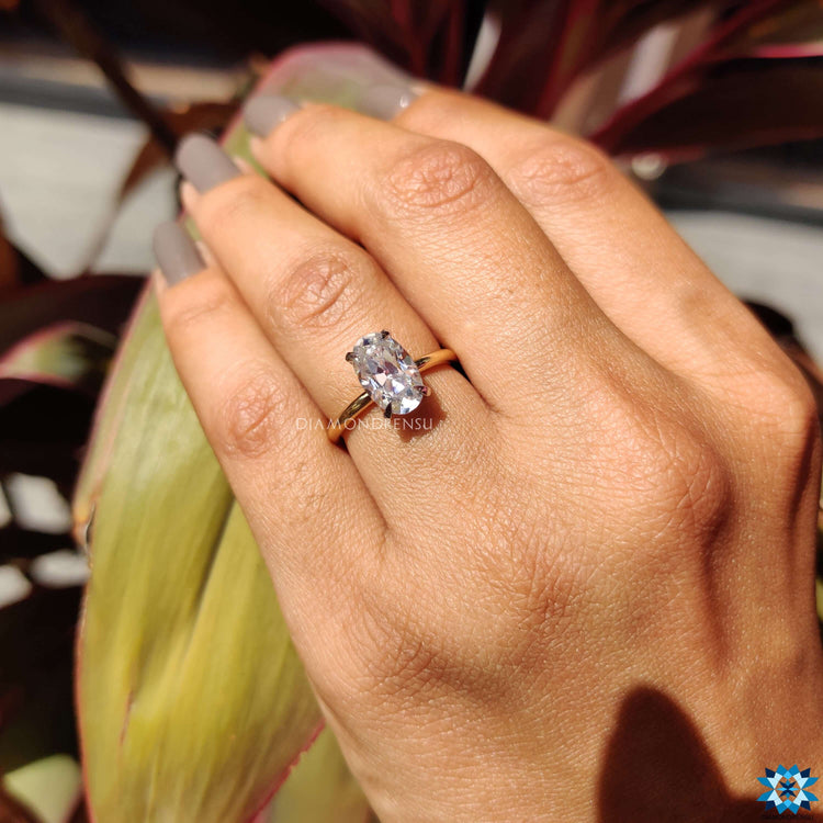 Handmade jewelry featuring Moval cut moissanite in yellow gold.

