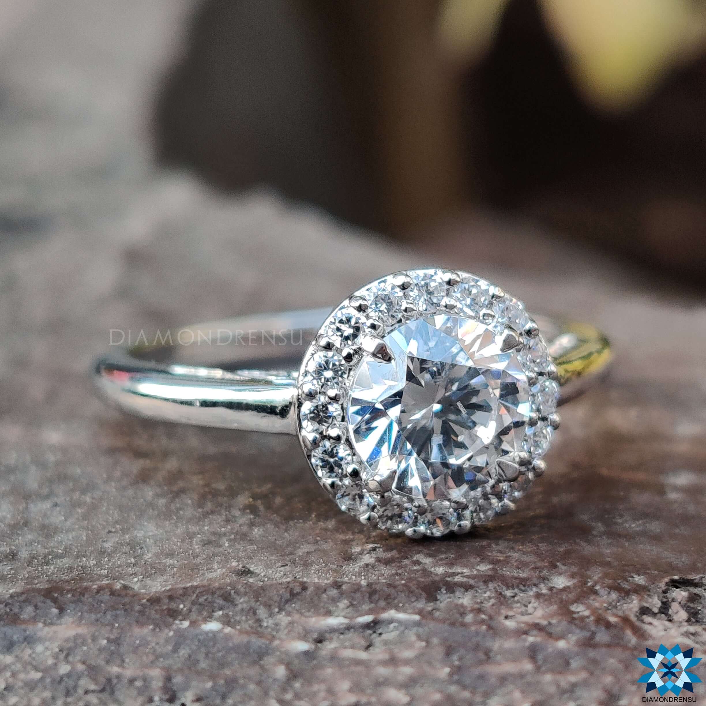 White gold engagement ring featuring a moissanite halo ring design.