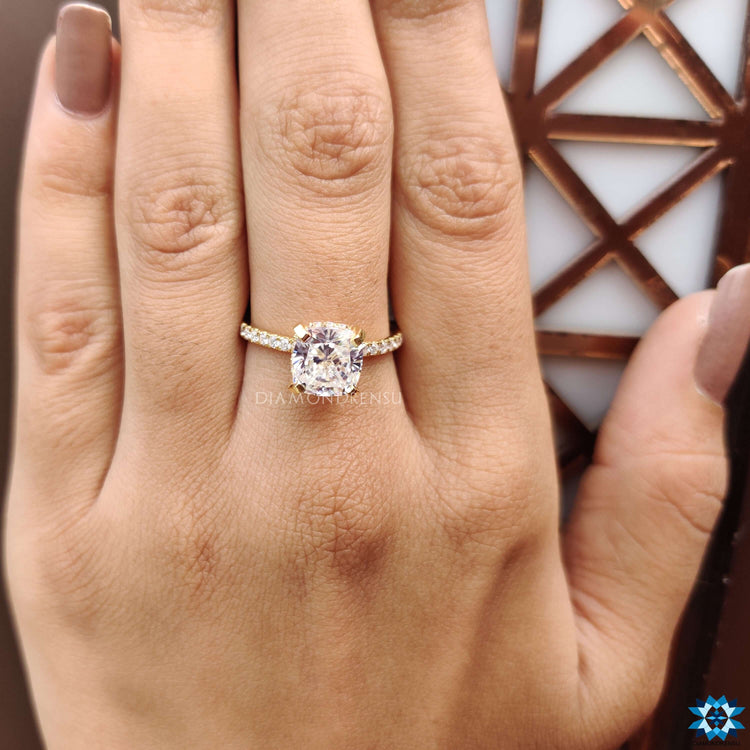 Custom engagement ring in yellow gold with pave moissanite design.
