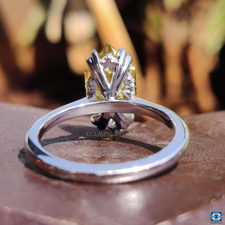 White gold ring featuring Dutch marquise moissanite.
