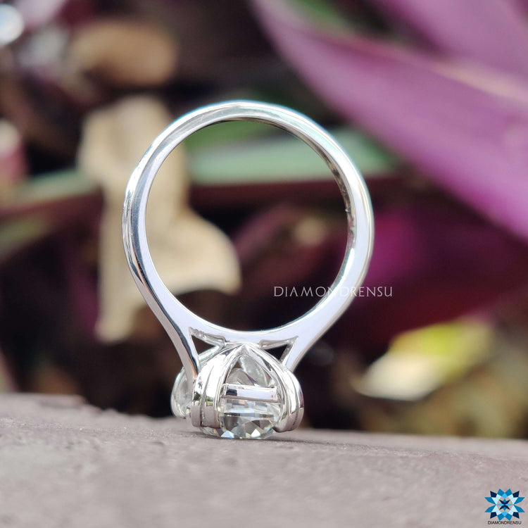 Custom moissanite ring featuring cushion old European cut.
