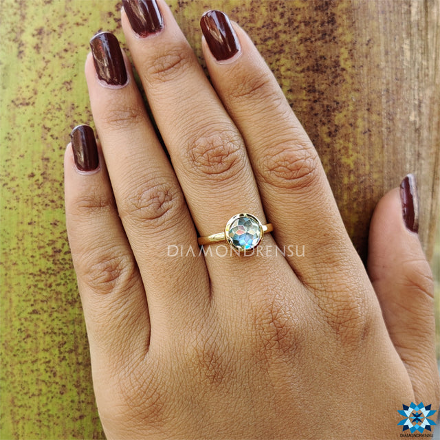 Handmade jewellery featuring round rose cut aqua blue moissanite ring.
