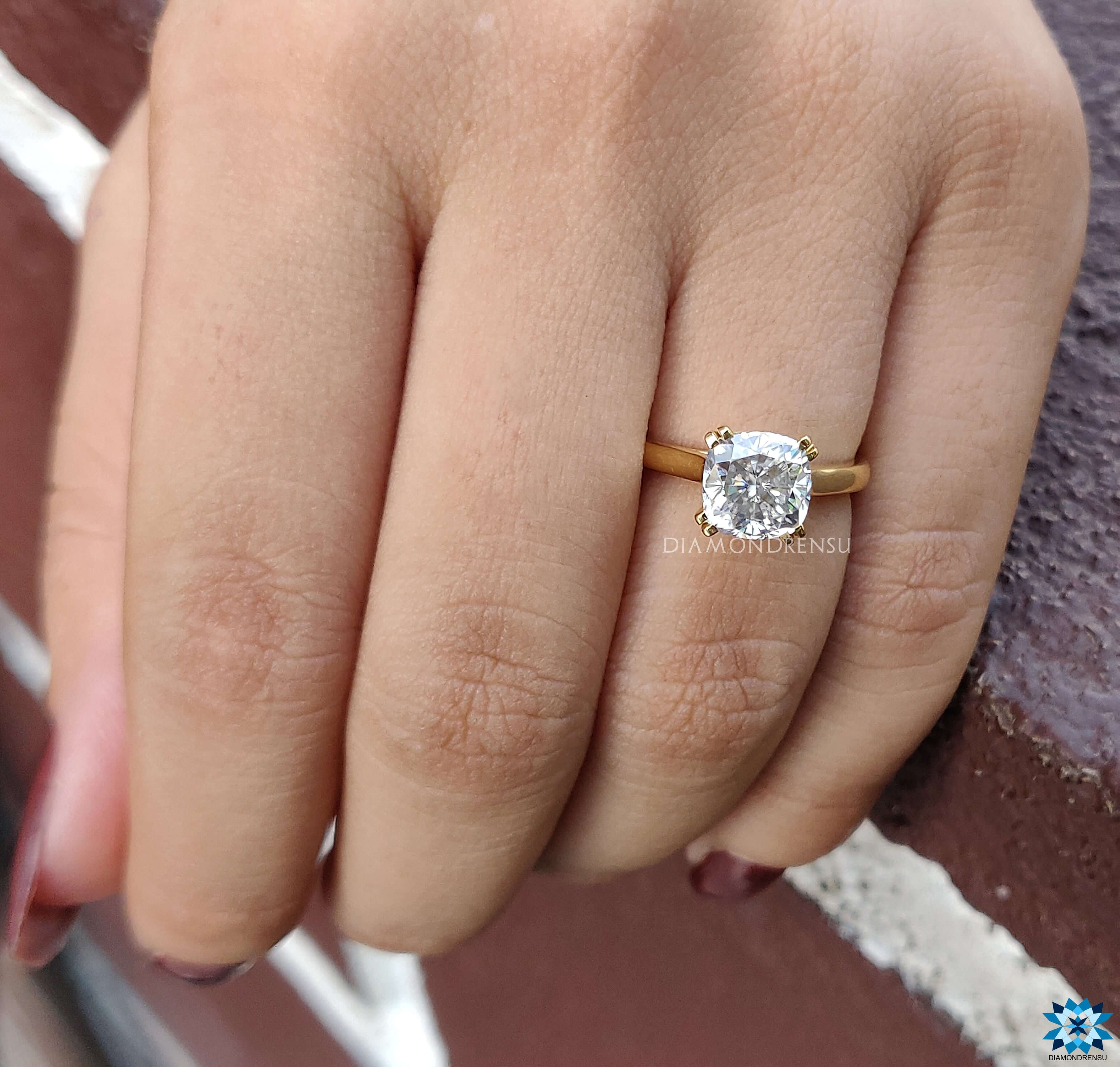 Buy engagement ring featuring a handmade ring design with square moissanite.
