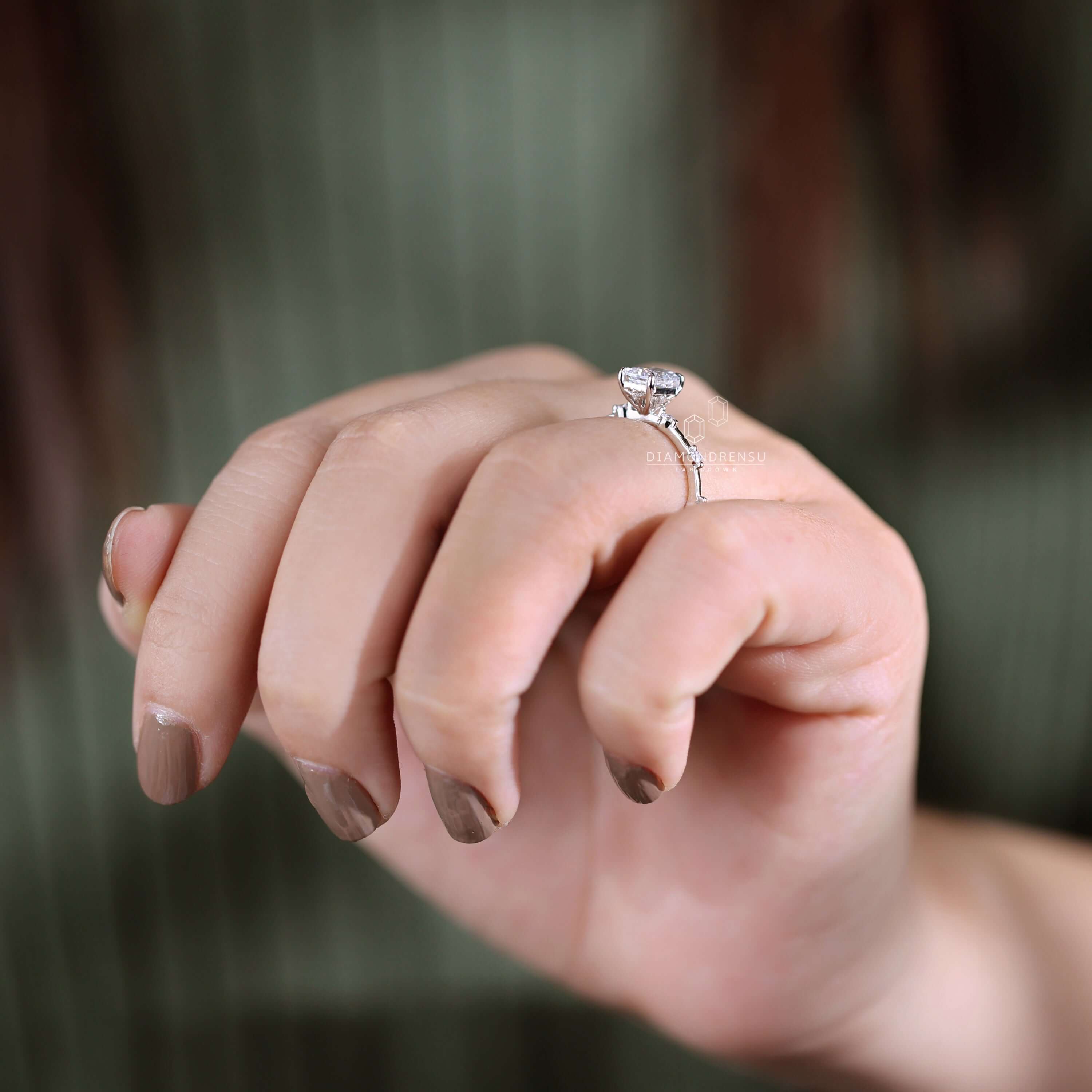 Claw prong ring with lab grown diamonds for eco-conscious elegance.