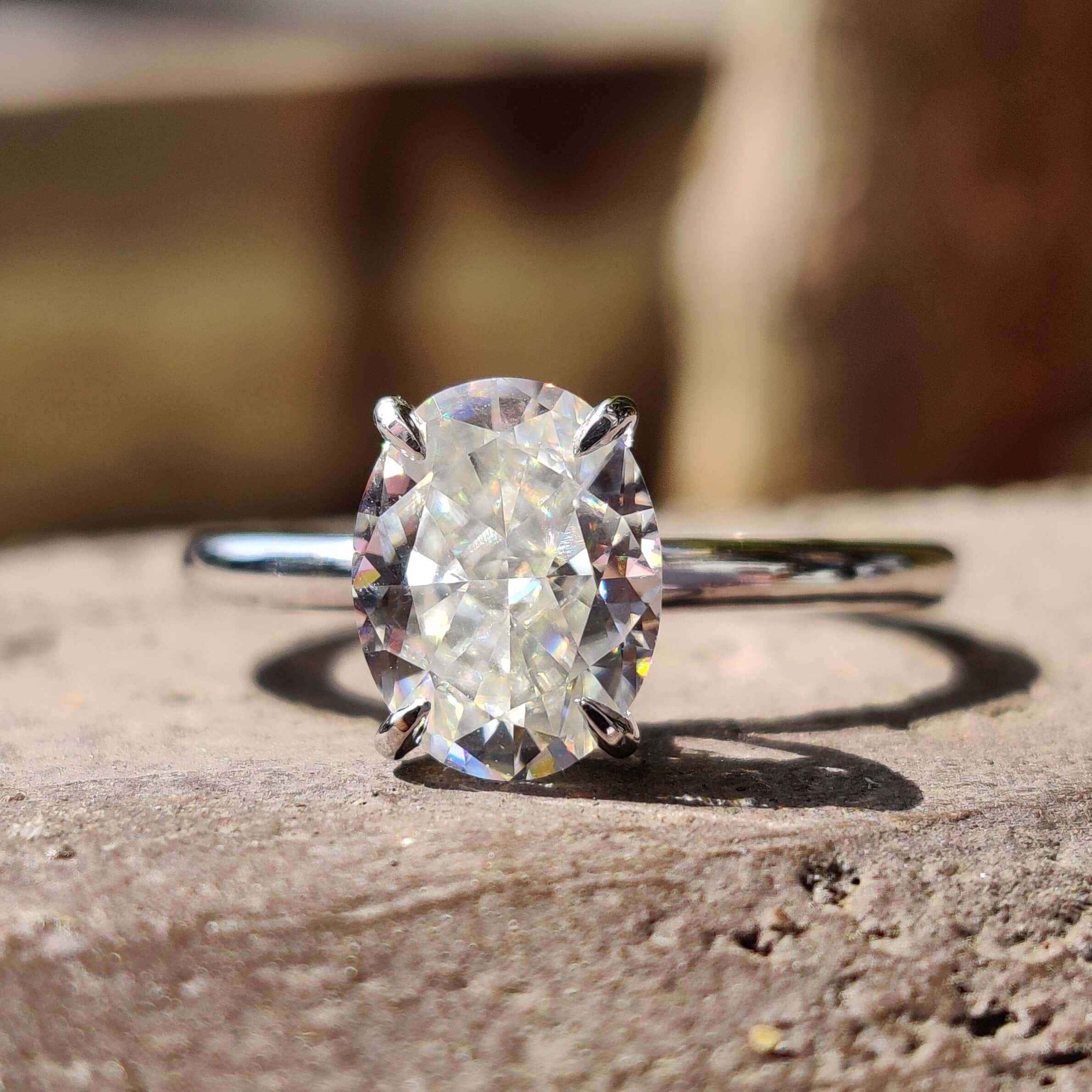 A stunning oval solitaire engagement ring featuring a brilliant oval cut moissanite center stone, perfect for an unforgettable proposal.