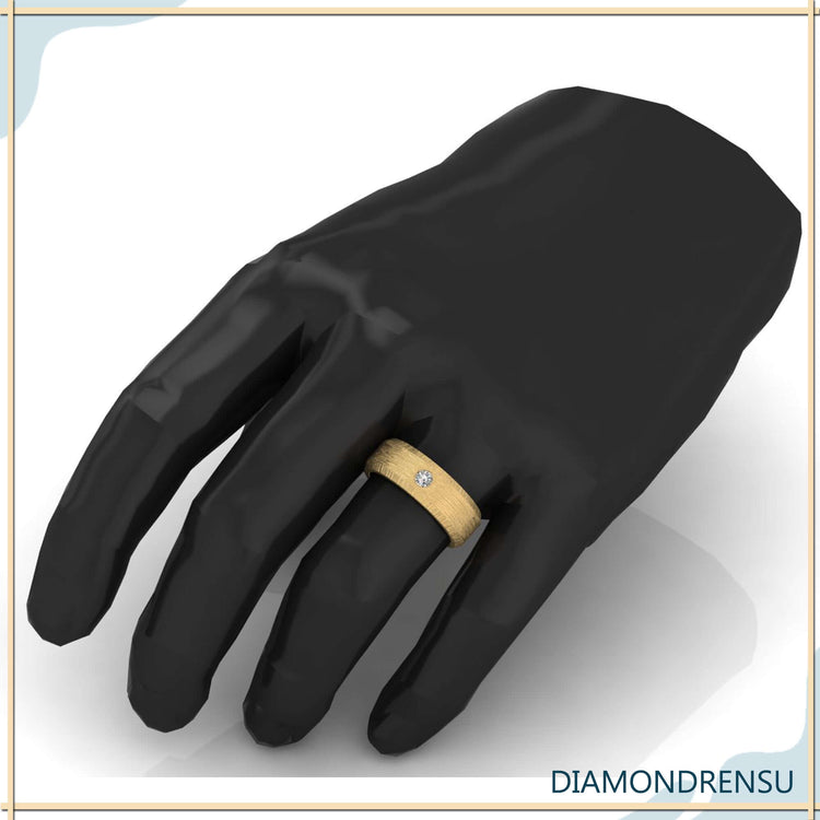 Mens diamond wedding band with flush setting and yellow gold finish.
