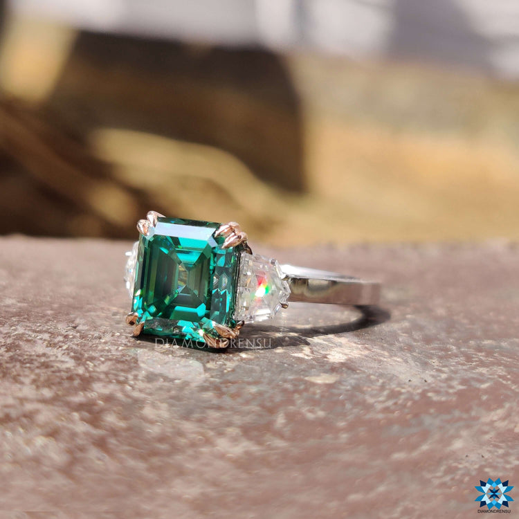 Asscher cut moissanite ring with side halo and split shank.
