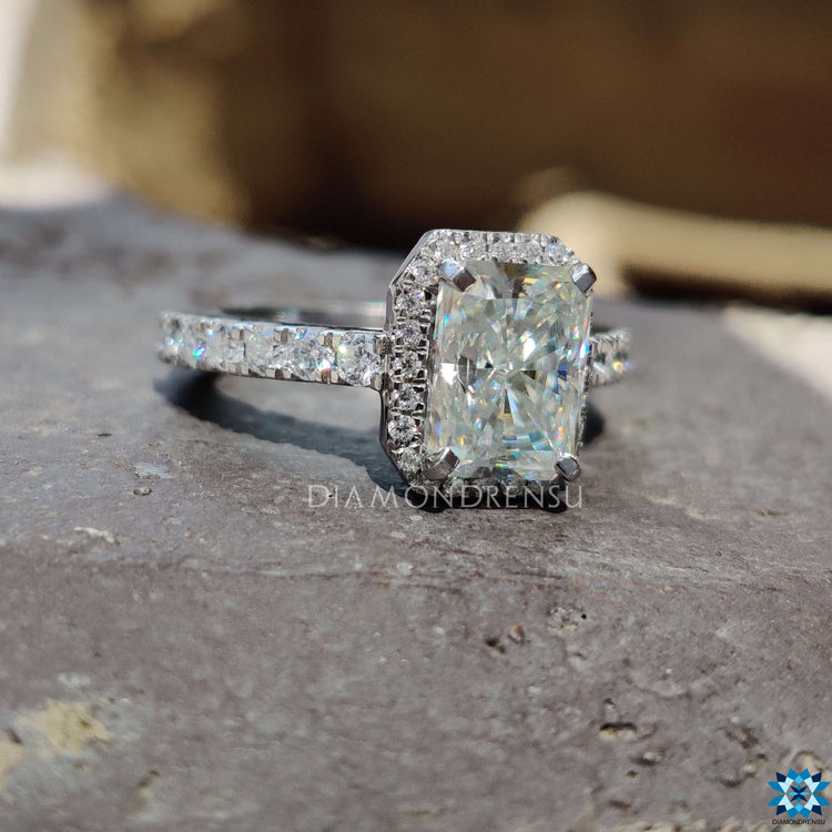 Custom moissanite ring with 4 prong setting and halo.
