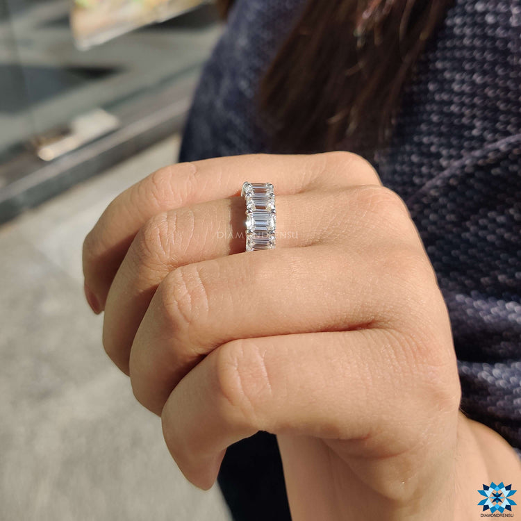 Emerald eternity ring offering vibrant color and brilliance.