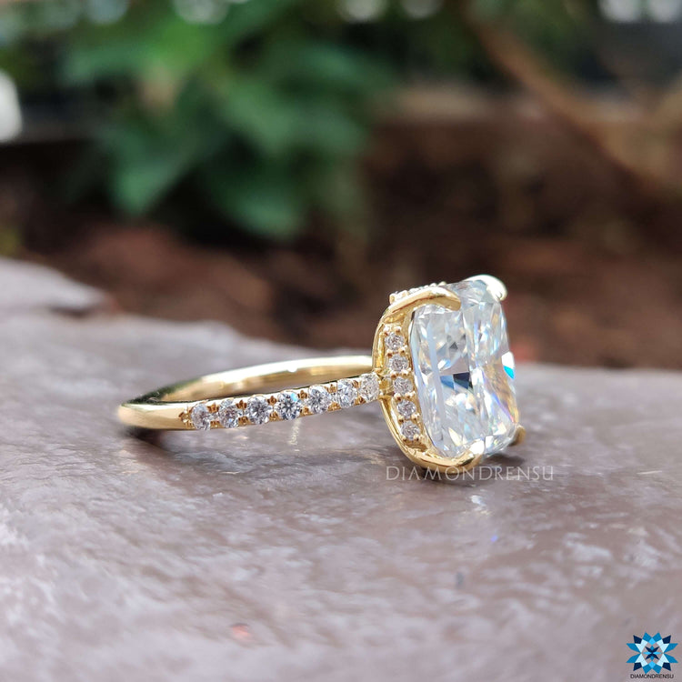 Handmade radiant cut engagement ring in pave setting.
