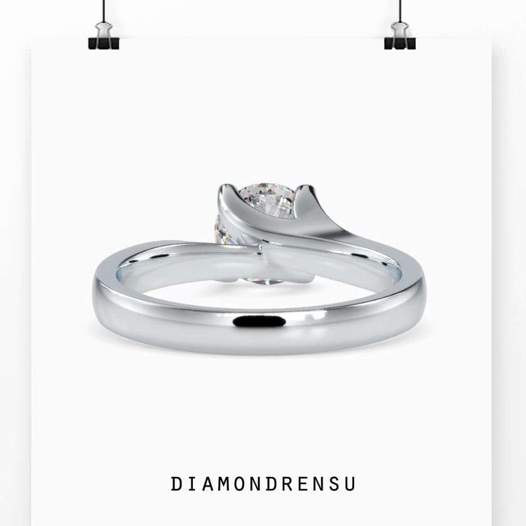 Custom engagement ring featuring bypass prong setting.
