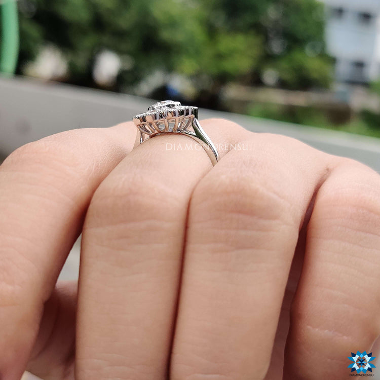 Round cut moissanite ring with vintage milgrain bezel design.

