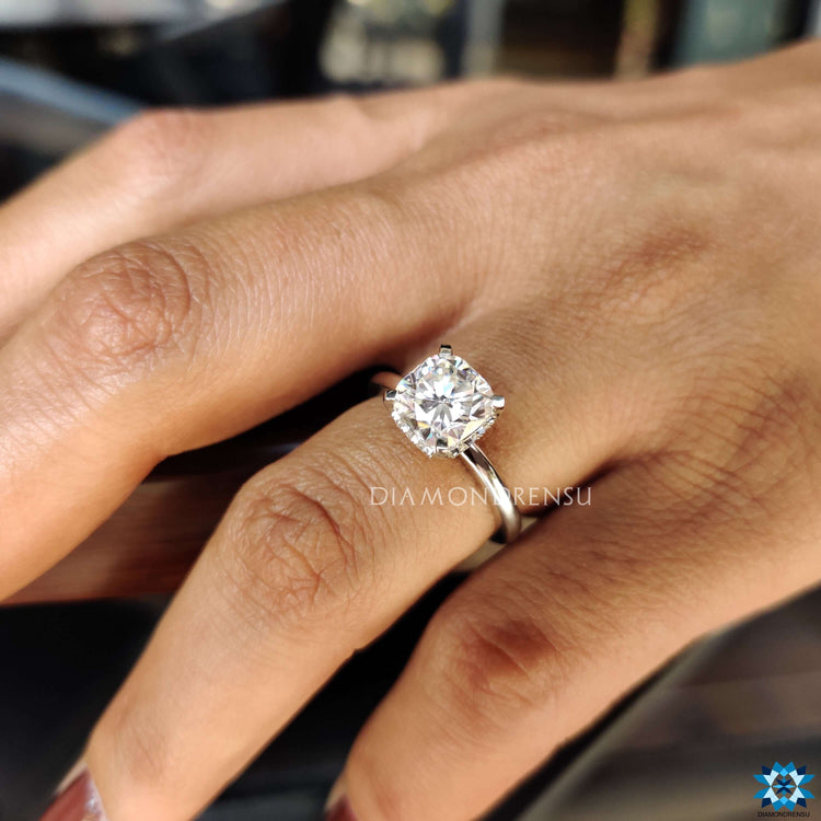 Buy cushion cut moissanite ring with hidden halo design.
