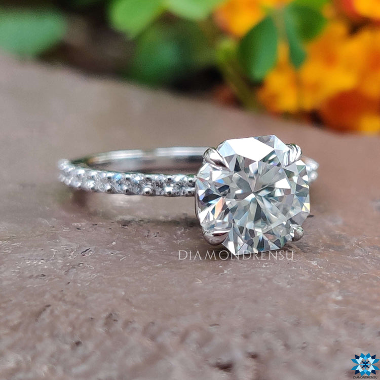 Moissanite pave ring with octagon cut center stone.
